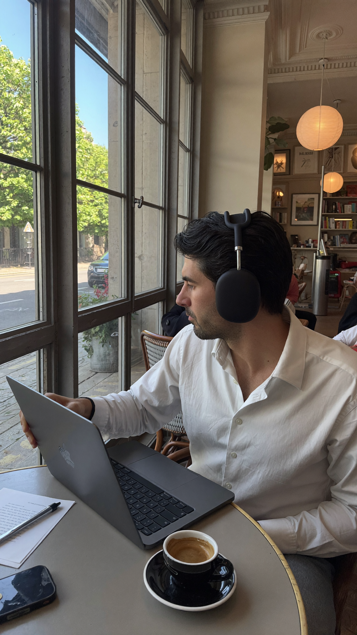 Laptop at a cafe, representing autonomous AI-powered blog publishing for DTC brands